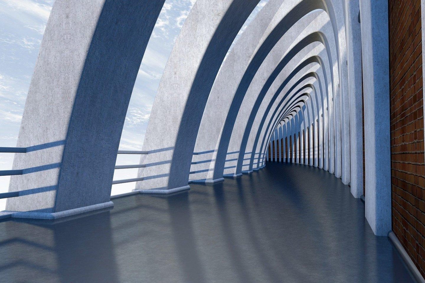 An architectural view of a long open hallway with curved walls and symmetrical patterns.
