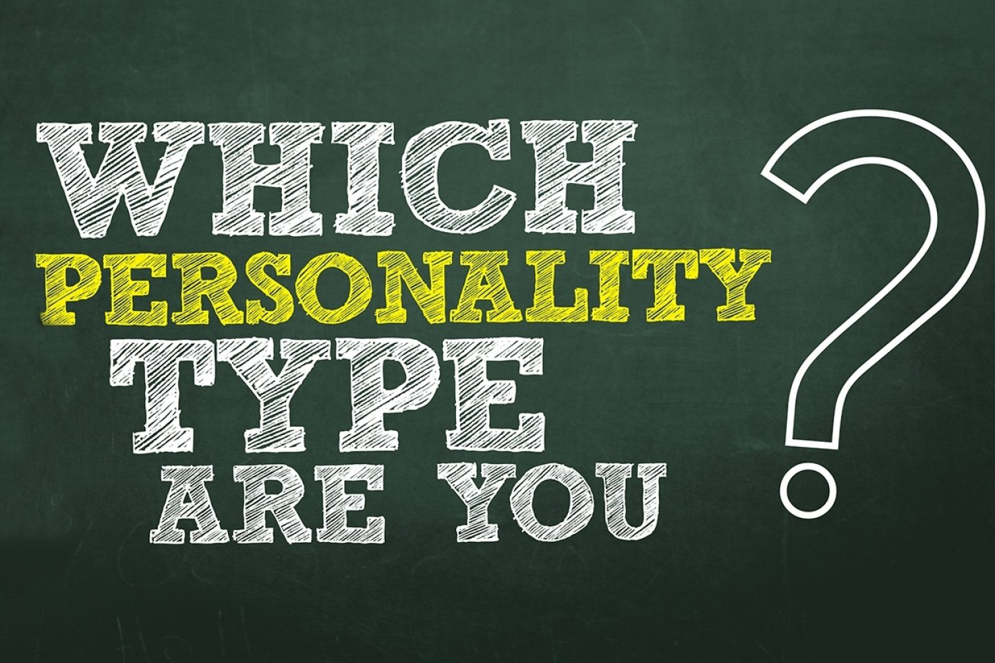 A green chalkboard has the text "Which personality type are you?" written on its surface. "Personality" is written in a yellow font color, while the rest of the words and question mark are written in white text.
