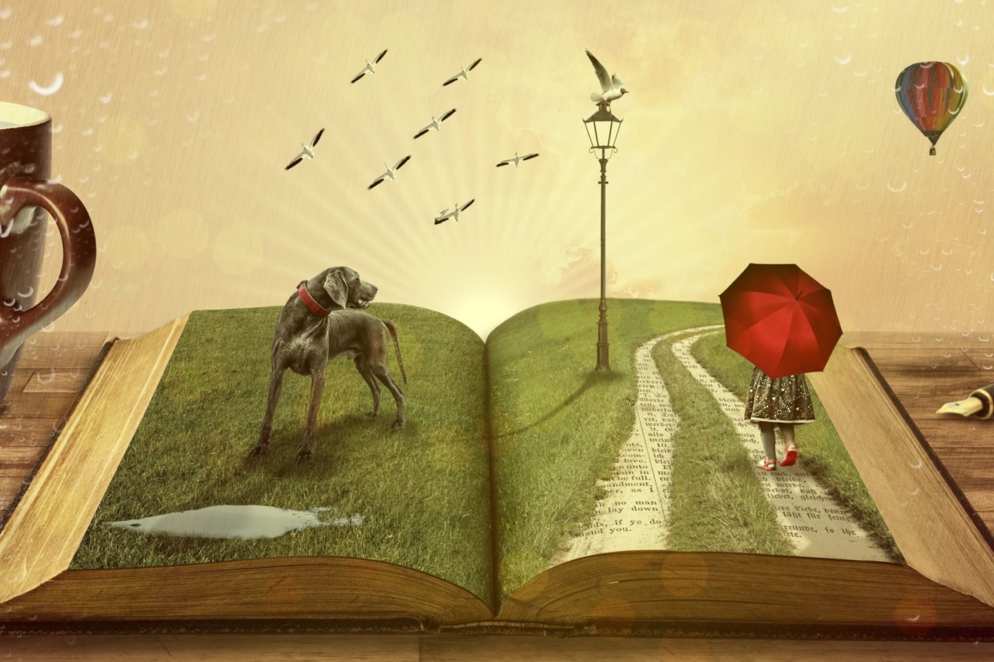 A computer-generated book is open on a desk with a fountain pen to the right and a mug with coffee to the left. Inside the open book is grass that covers both two pages. A girl is walking on the right page with a red umbrella covering the back of her head and upper body. She walks on a path that shows the page's words underneath the grass. There is a lamppost with a seagull ahead of her. Beyond this are more seagulls flying and a hot air balloon in the distance. The left page shows a large gray dog looking over toward the girl.