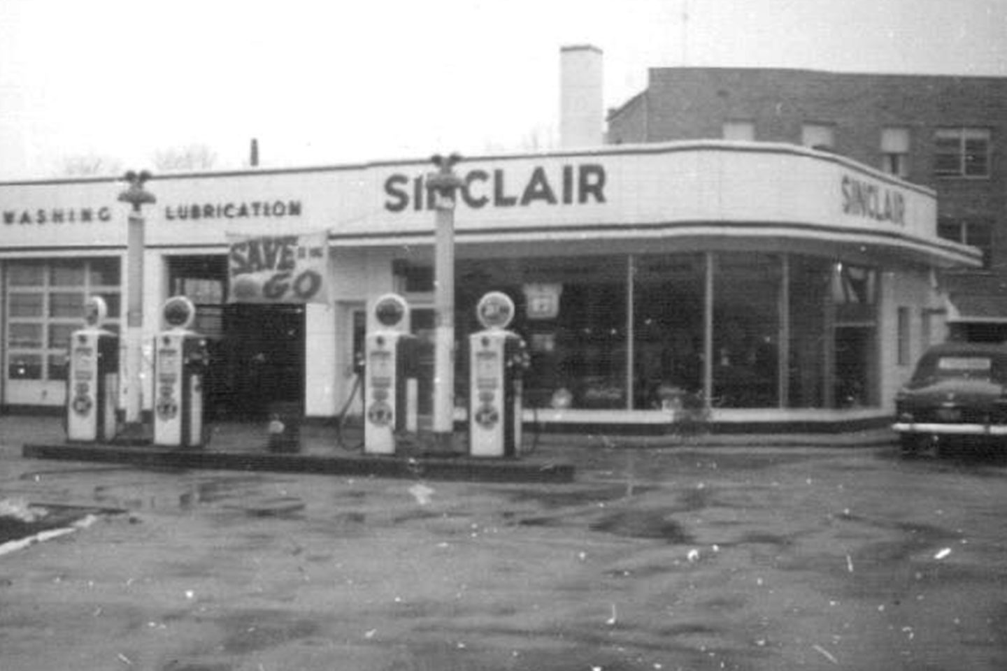 A black-and-white photo of the old West Toledo Sinclair building.
