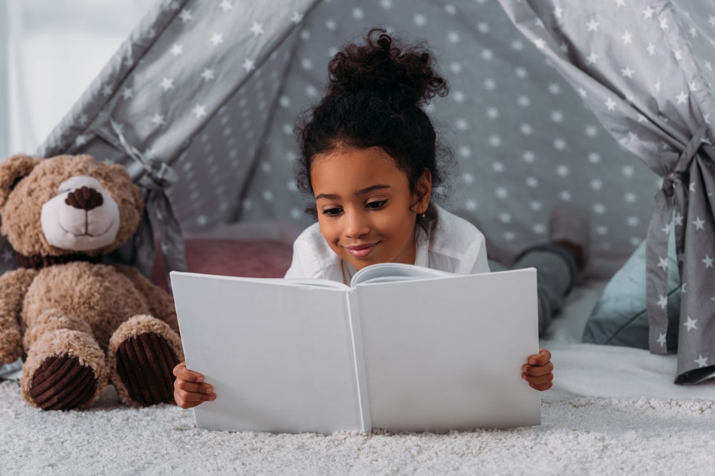 african american kid reading book