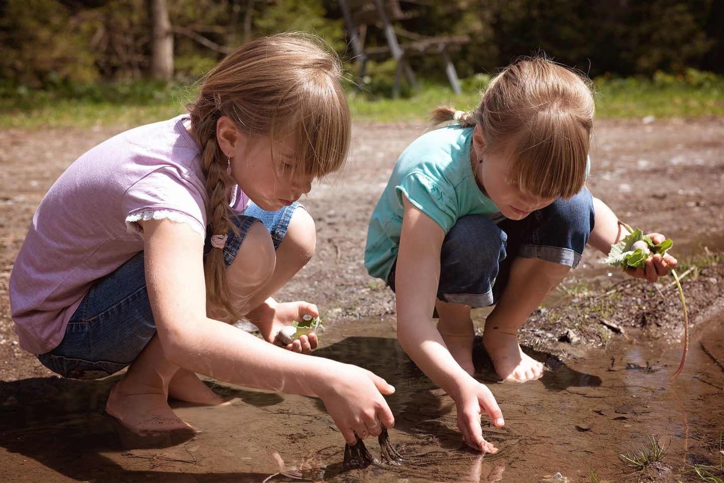 children outdoors learning playing