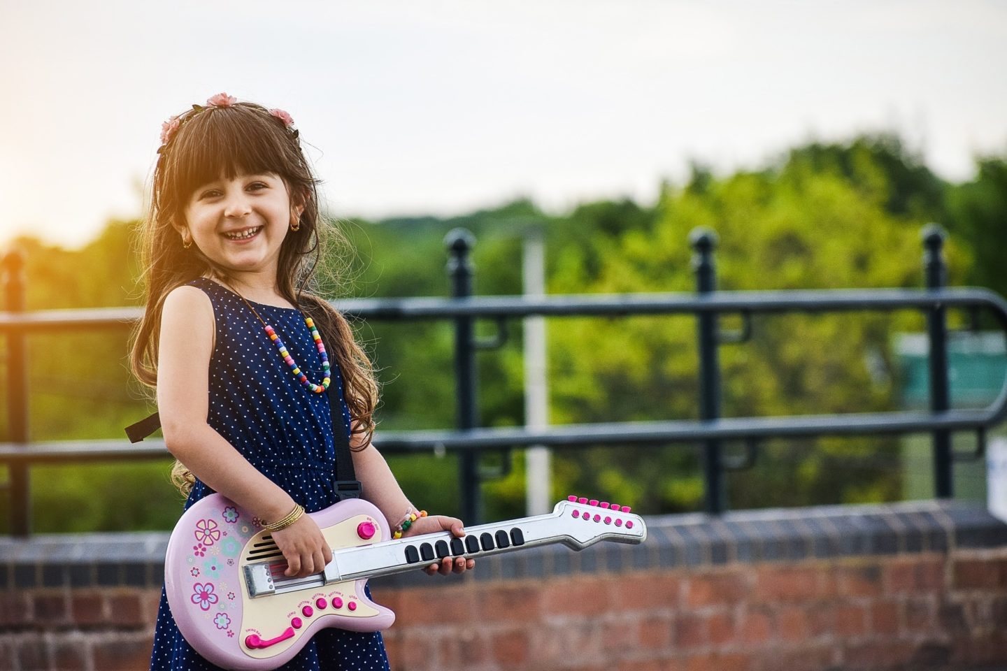 happy child playing guitar