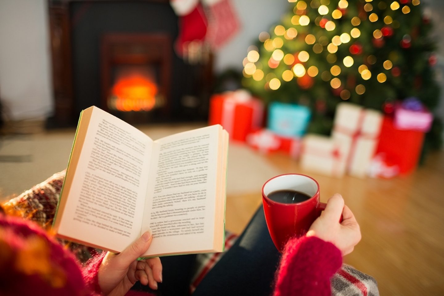 reading a book and drinking coffee at christmas