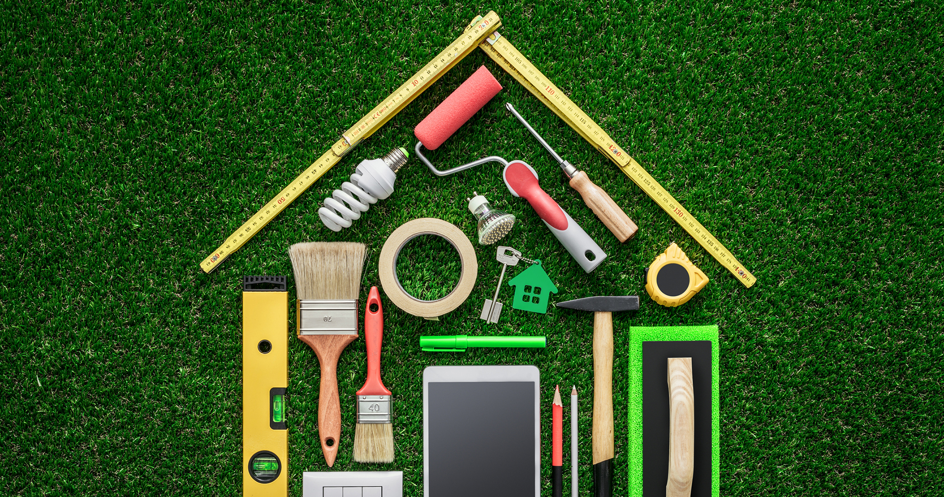 Building tools in the shape of a house on grass. Building tools in the shape of a house on grass.