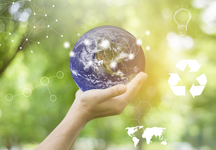 Human hand is holding World on green, save earth concept. element furnished by NASA a hand holding the world with nature around