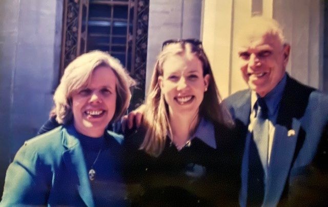 Christine Mayle with parents after being sworn into the New York bar as a lawyer 