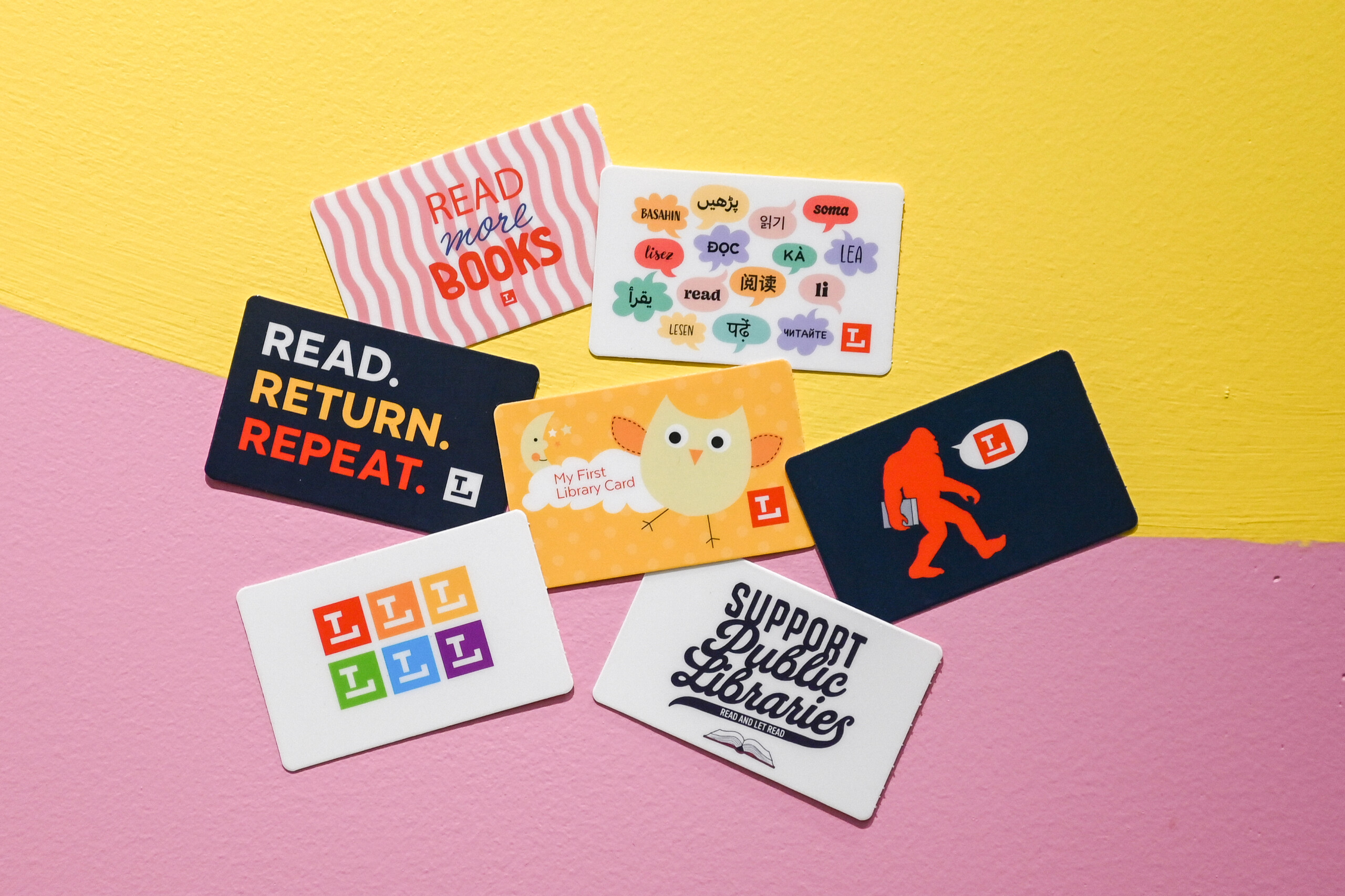 Different Library card options on yellow and pink background. Different Library card options on yellow and pink background.